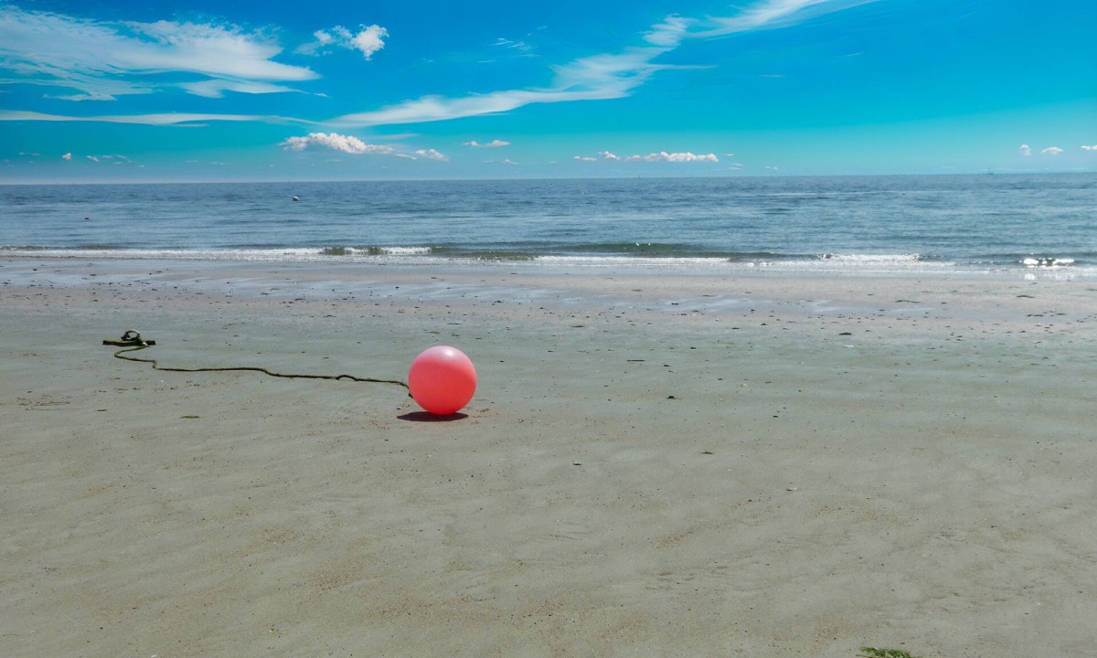Heligoland dunes beach with buoy