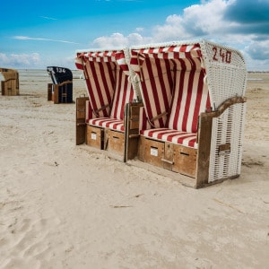 Red beach chairs on the North Sea island Amrum